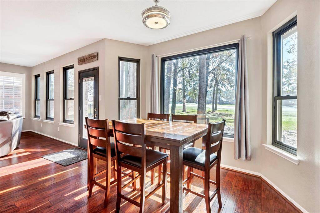 Bright breakfast nook with expansive windows.