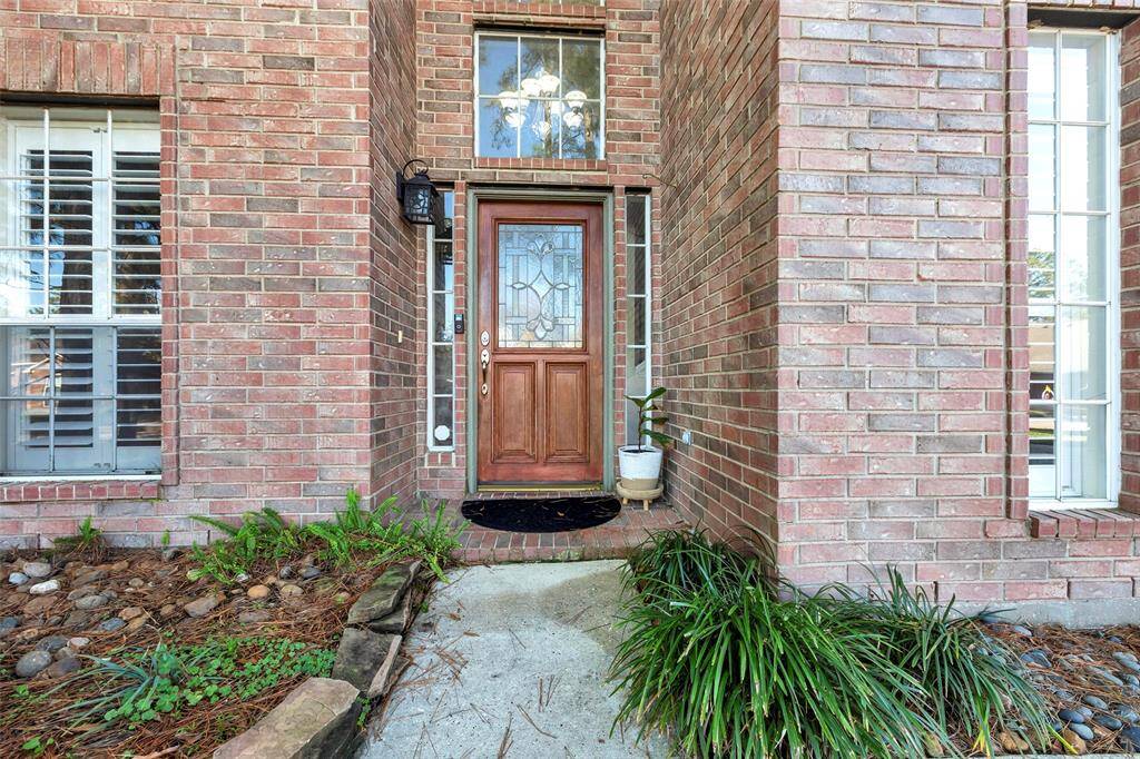 Welcome home through an elegant leaded glass door.