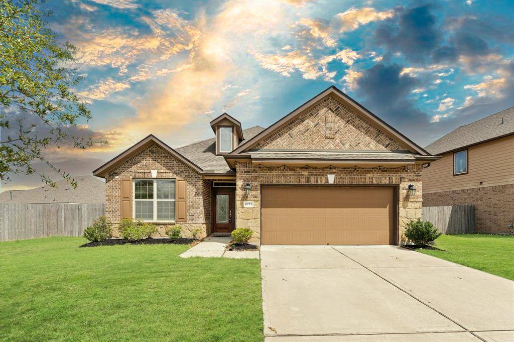 Welcome home to this charming one-story beauty, featuring a lush, manicured front lawn and a spacious driveway.