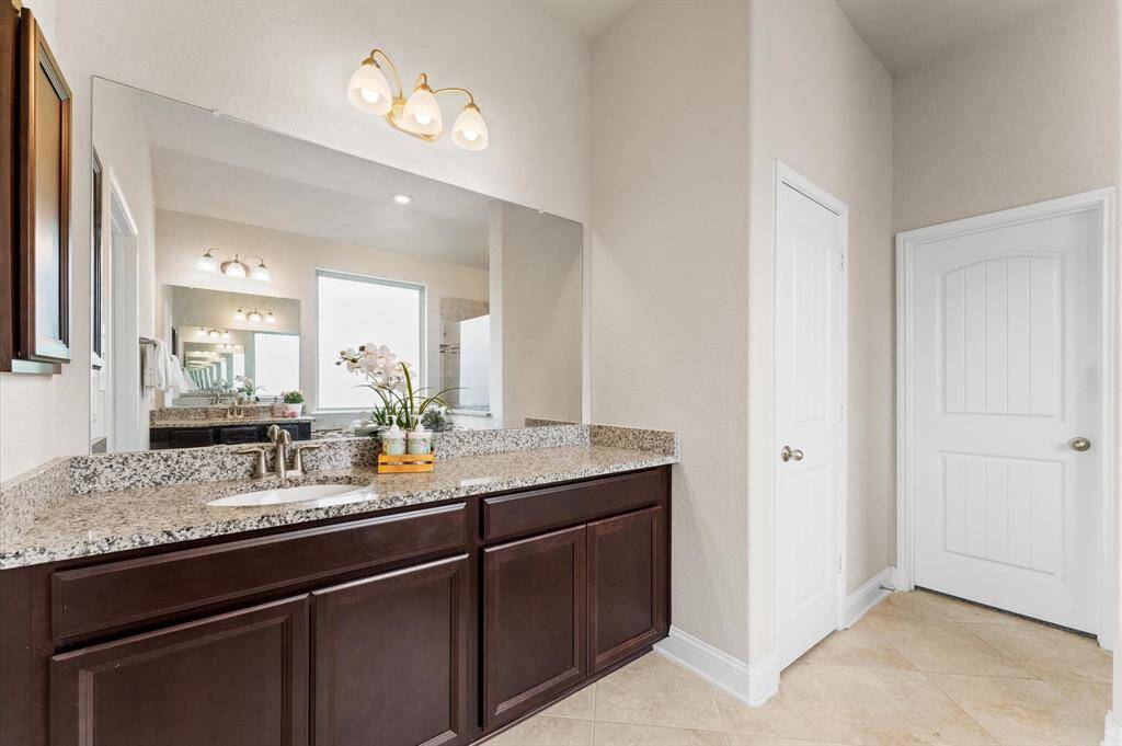 Double vanities offer ample space, making mornings effortless.