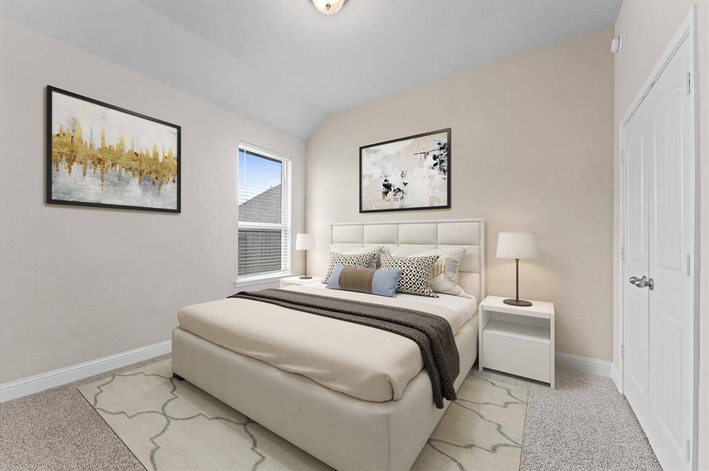 This second bedroom is a delightful retreat with natural light pouring in from wide windows. Plush carpeting enhances the cozy feel, making it the perfect space to unwind.