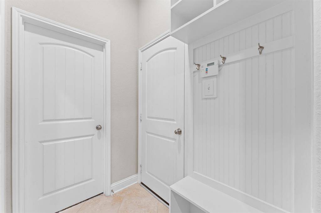 The mudroom provides a functional space to keep everything organized.
