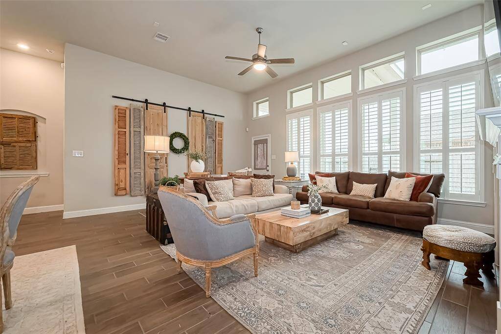 Large floor to ceiling windows help fill this room with natural light