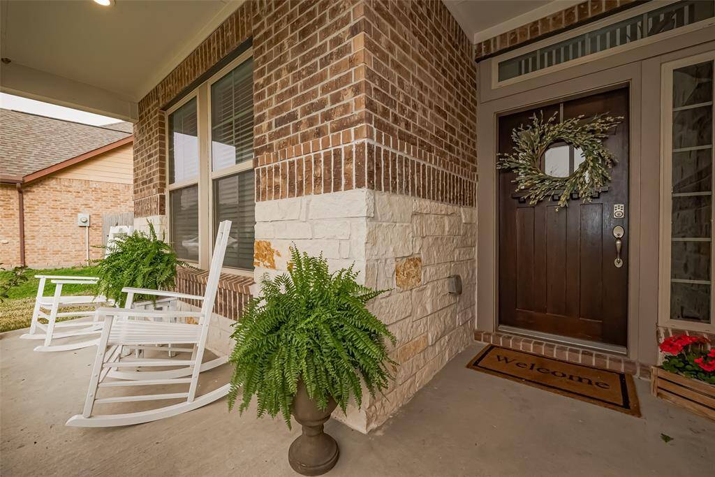 Welcoming front porch as you walk towards the front door