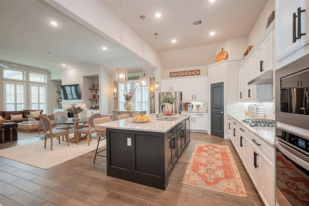 Beautiful & spacious kitchen greet you as you make your way through the home.