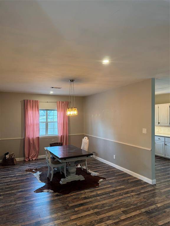 Generous size formal dining room off of kitchen.