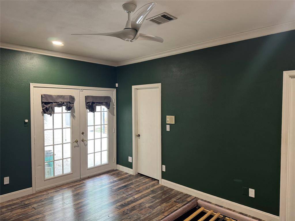 Master bedroom has french doors leading to covered patio.
