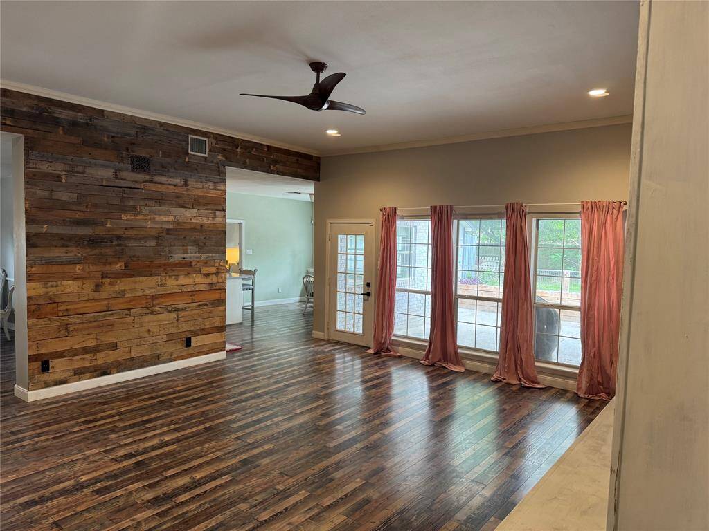 Den has an accent wood wall