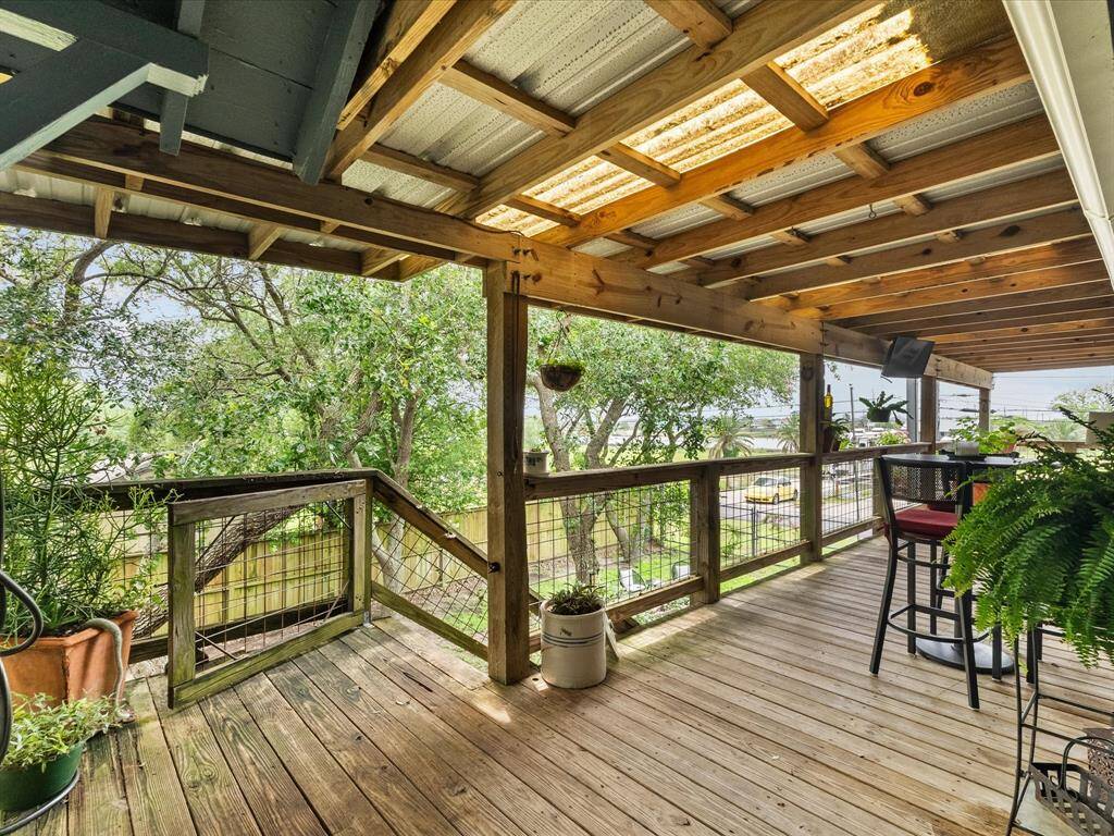 Front patio porch with sunset & water views!  Acess to the primary bedroom from here.