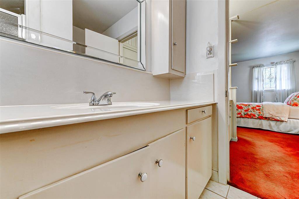 Extended vanity and dressing area conveniently located near the primary bedroom. Large mirrors, ample cabinetry, and easy access to the bedroom create a perfect flow for daily routines.