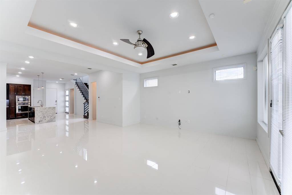 This photo showcases a high ceiling with recessed lighting.