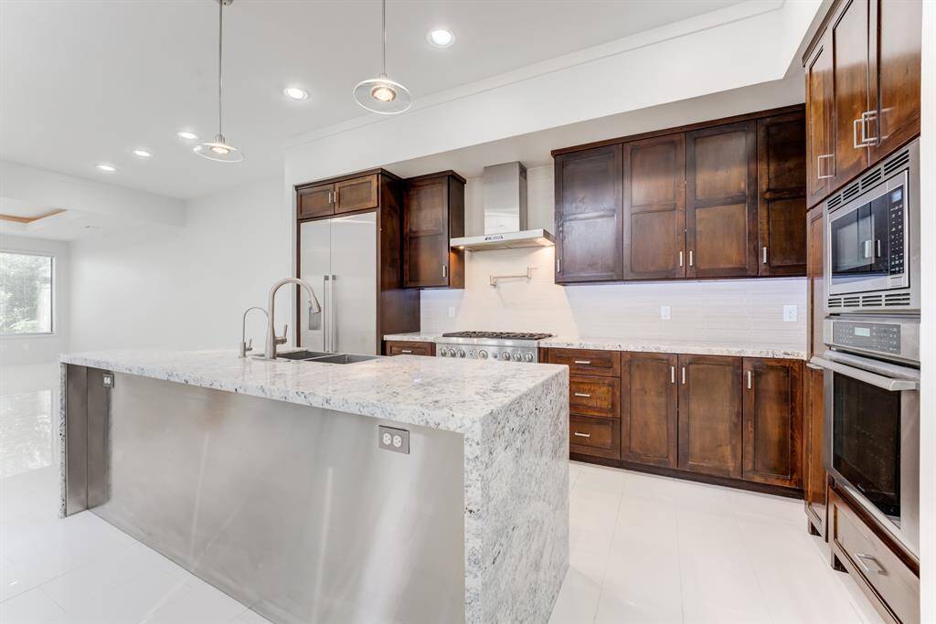 The open layout includes recessed lighting and a bright, airy atmosphere.