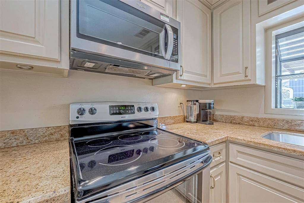 Electric stainless steel appliances.  Home is wired for gas or electric. Microwave is new!