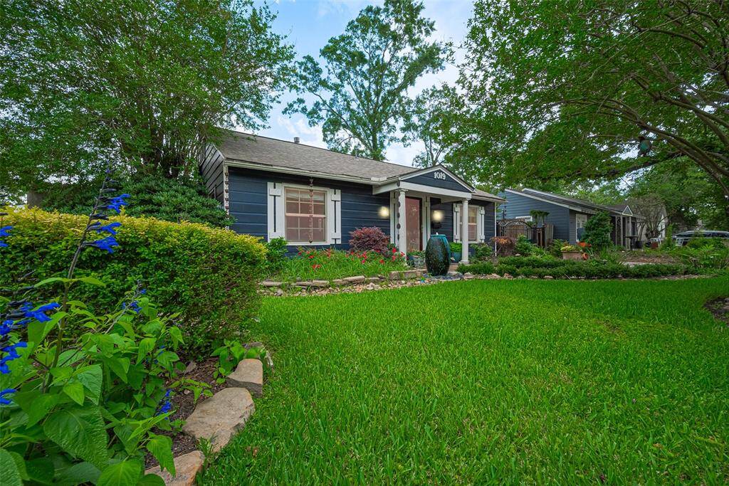 Stunning gardens surround this perfectly maintained home.