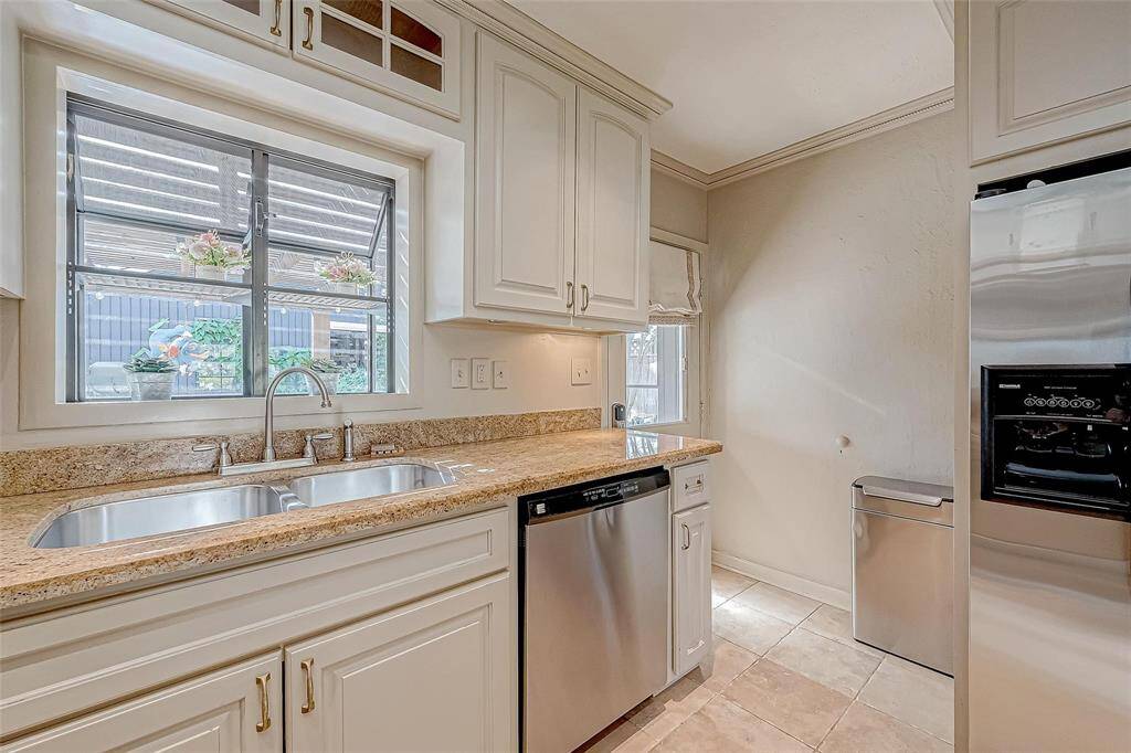Kitchen has a backdoor that opens up to the pergola.