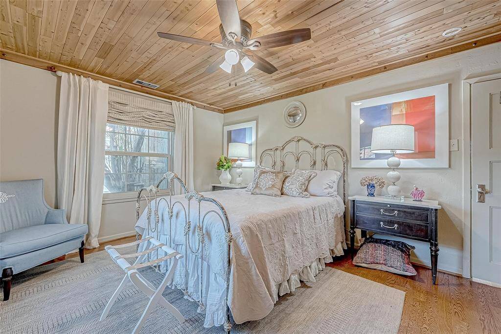 Front bedroom is a fan favorite with cedar ceilings, new ceiling fan and views of the garden.  Very peaceful.