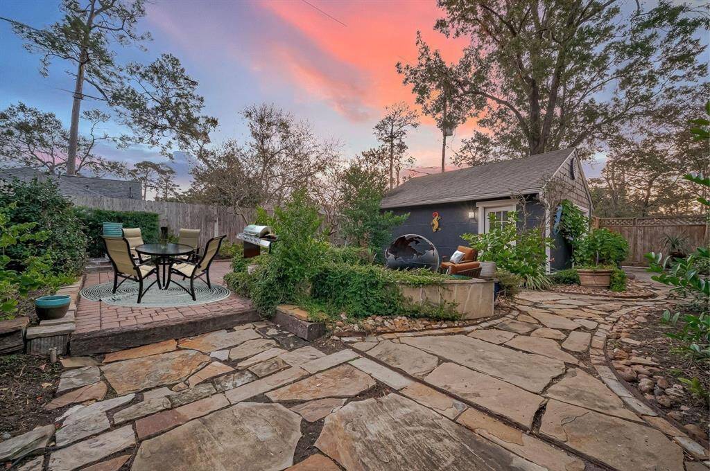 View from the other side of the house, you have a back patio, elevated patio deck and fire pit area - fire pit included.