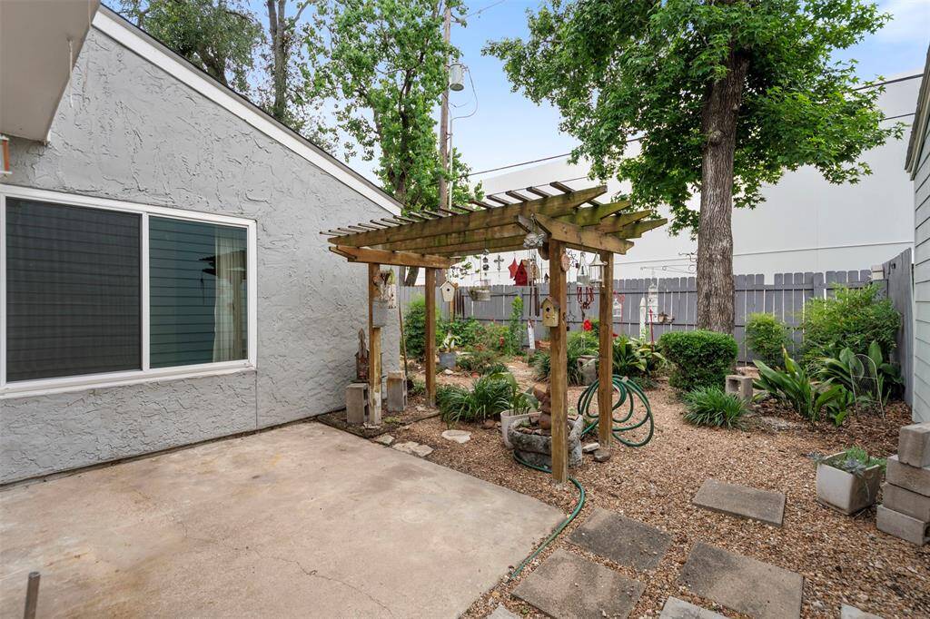 Patio off the dinning area has a charming wood pergola