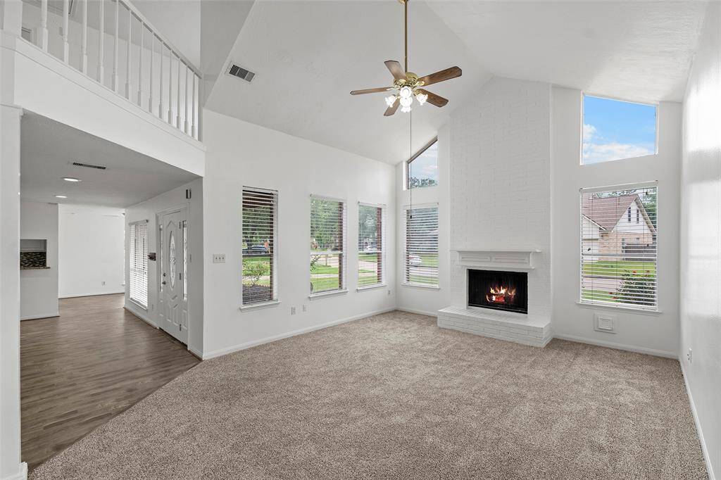 Living room with recent paint and carpet.