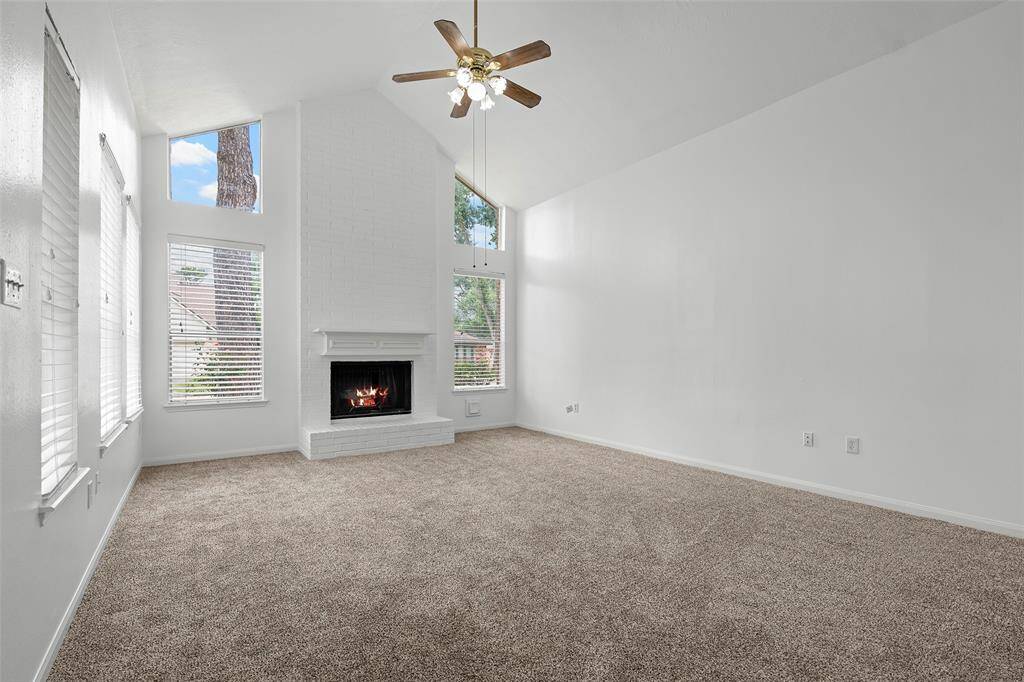 Beautiful cathedral ceiling and wood burning fireplace with gas connection.