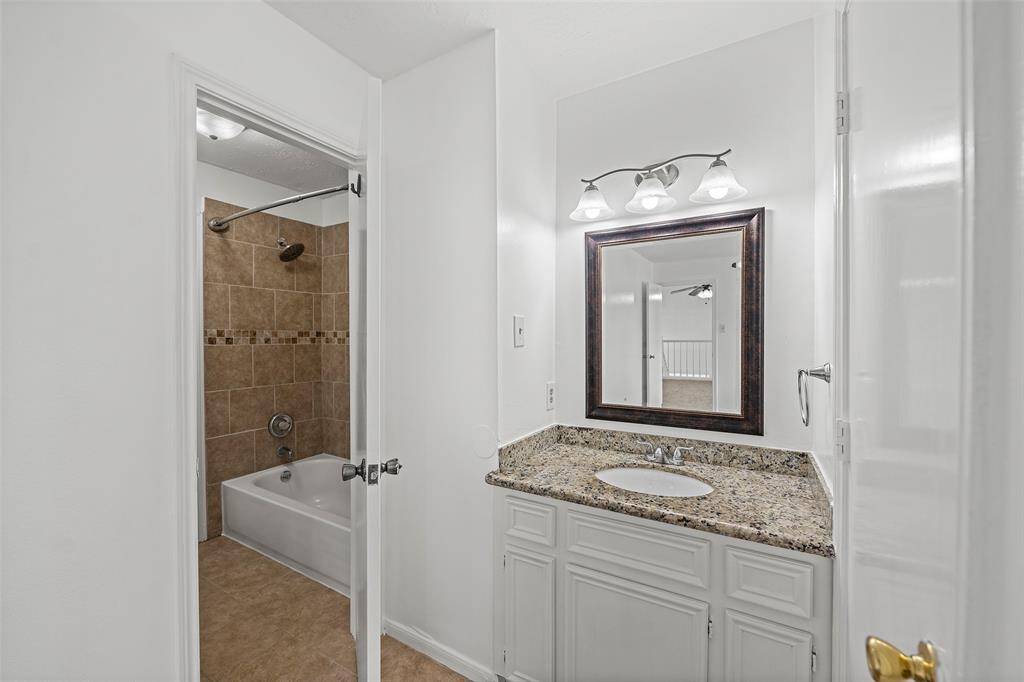 Bedroom number#2's sink area with granite countertop.