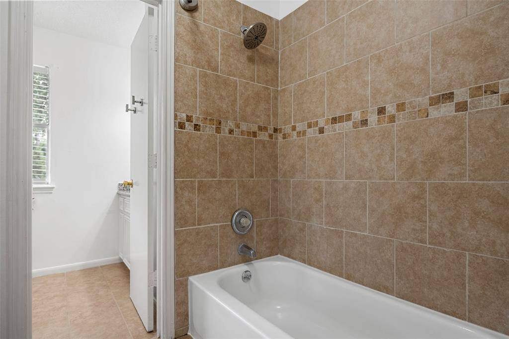 Jack and Jill bath with shower/tub combo.