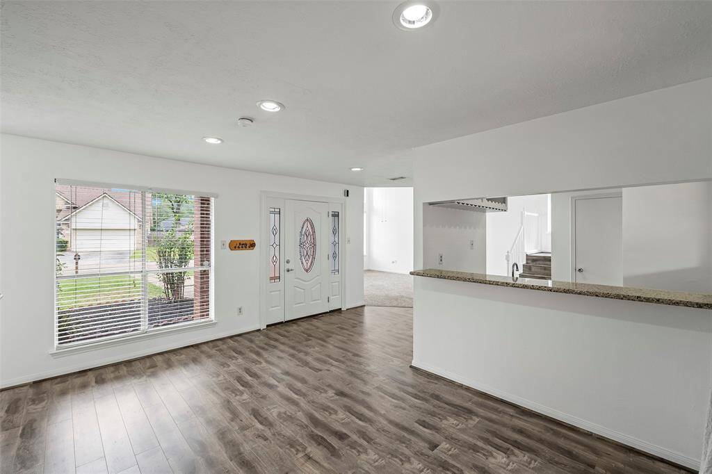 Recent updates include: wood flooring, recent paint & carpet, and granite countertops.