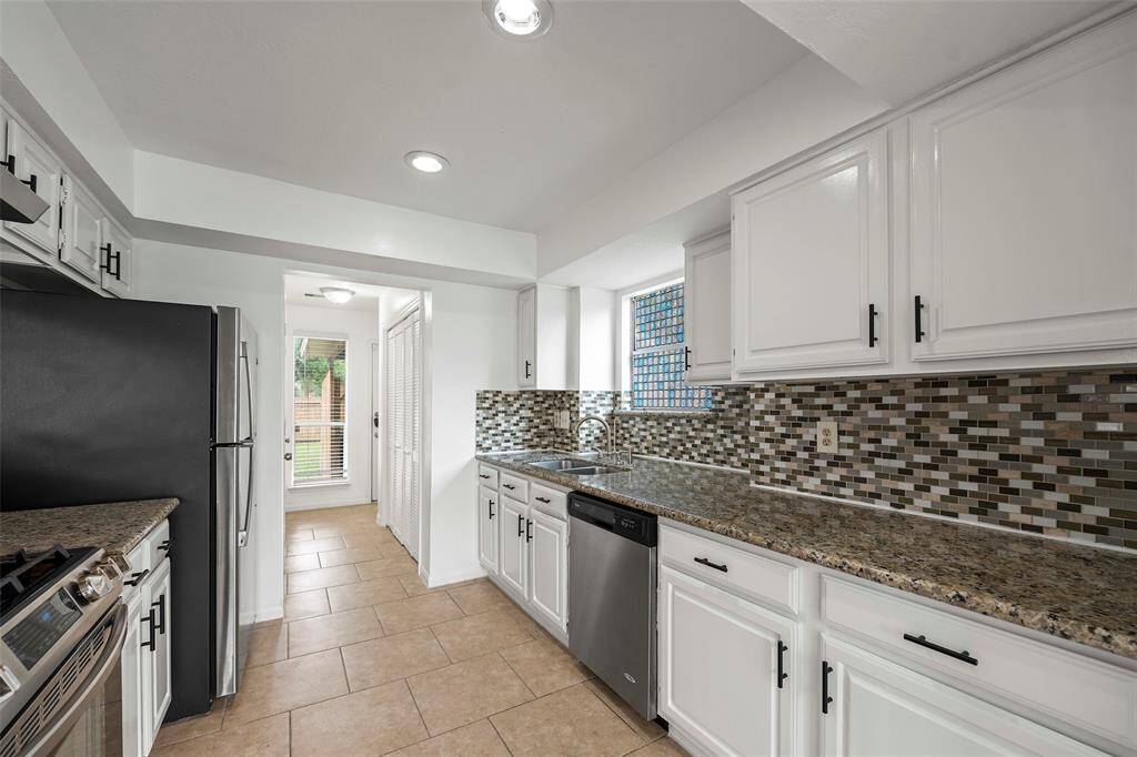Stainless steel appliances, 5 burner gas cook top. Refrigerator included.