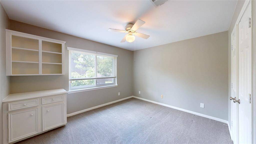 Bedroom 3 offers built-in cabinets.