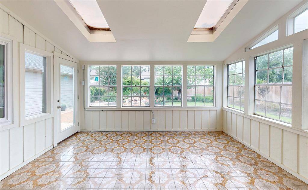 The enclosed patio could also be used as a game room or just a great space to entertain.