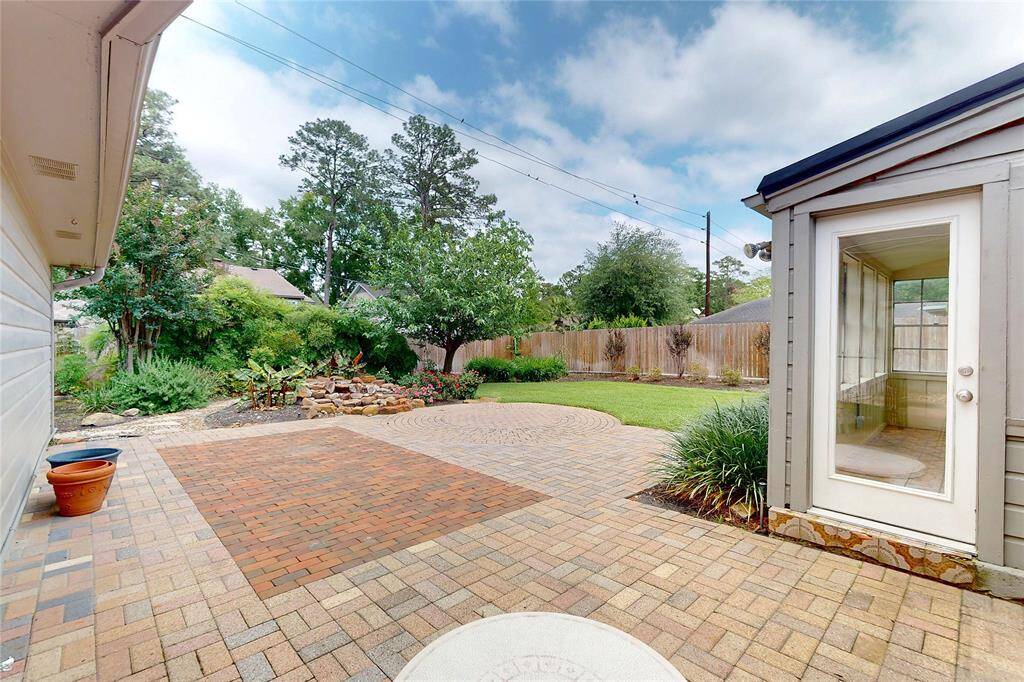 Great backyard with a pond water feature.