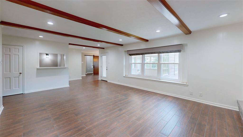Another view of the family room and the porcelain tile plank floors.