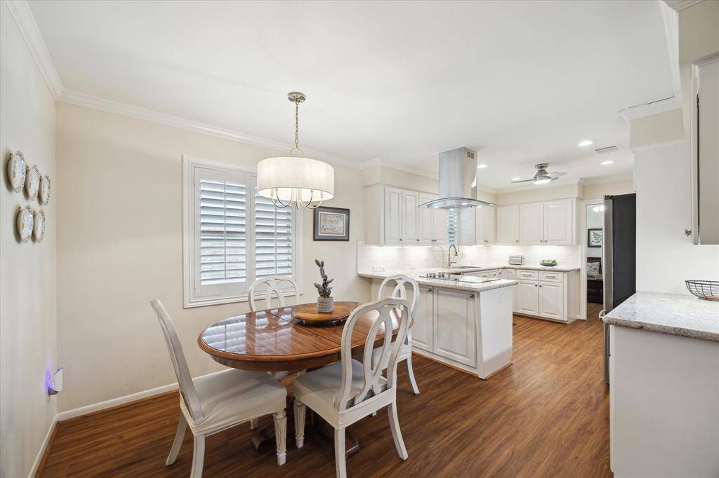 The breakfast room flows seamlessly into the kitchen for easy serving.