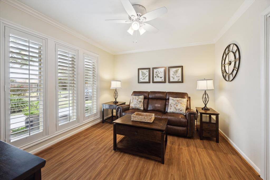 This flex room with floor-to-ceiling windows could be used as a mediaroom, office/study, playroom or other.