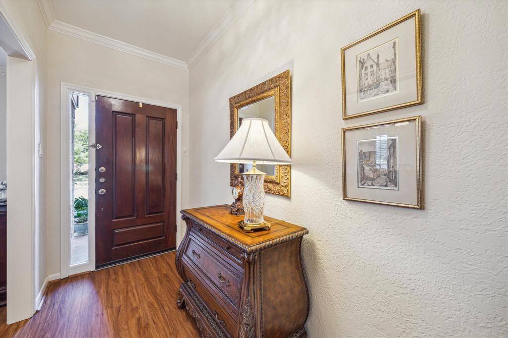 A glass panel provides additional light to the entryway.
