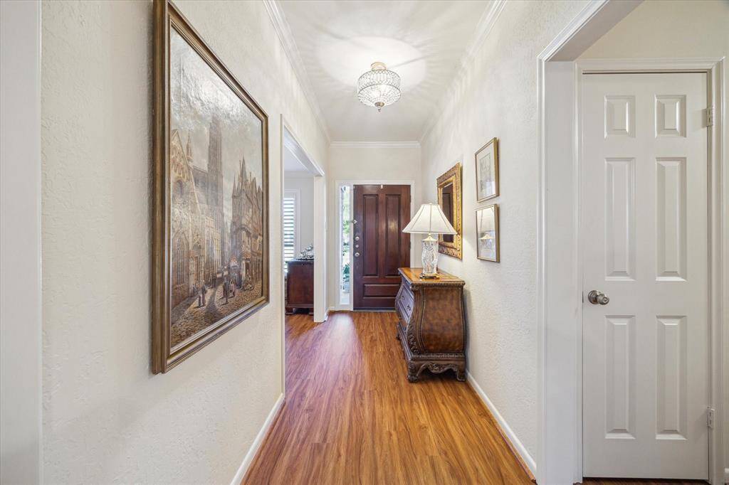 Classy, updated light fixtures adorn the entry and other rooms.