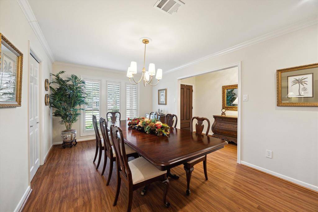 Large windows look out over the front landscaping and provide plenty oflight for the dining room. Plantation shutters cover most windows in thehouse.