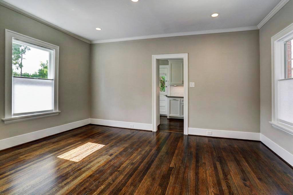 Large Dining Room with 6" recessed LED lighting, original oak flooring and 4 over sized windows which fill the room with natural lighting.
