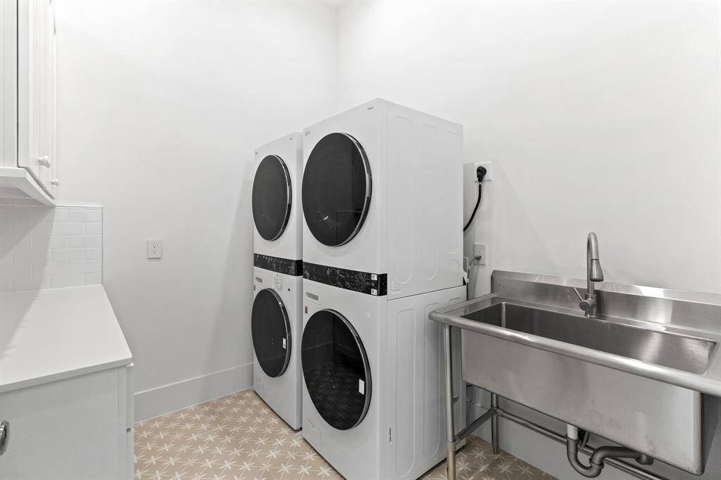 Utility room with two sets of washer and dryers, third floor