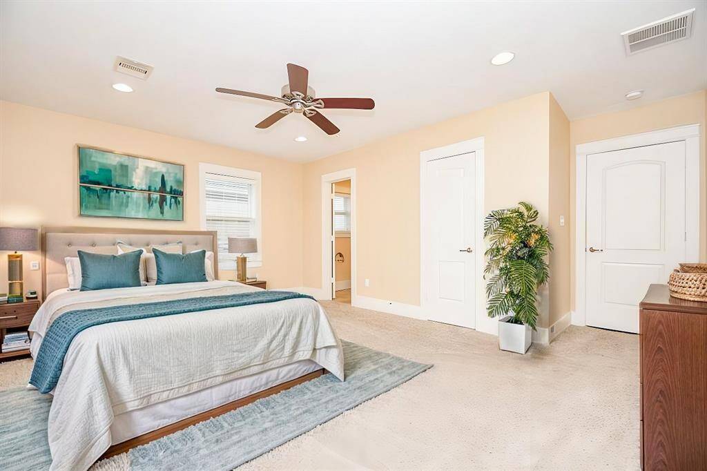 Spacious primary suite virtually staged to highlight its size and layout potential.