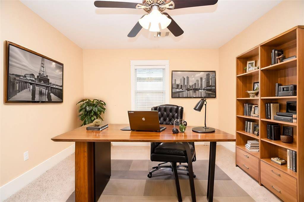 Third bedroom virtually staged, ideal for a home office or cozy nursery.