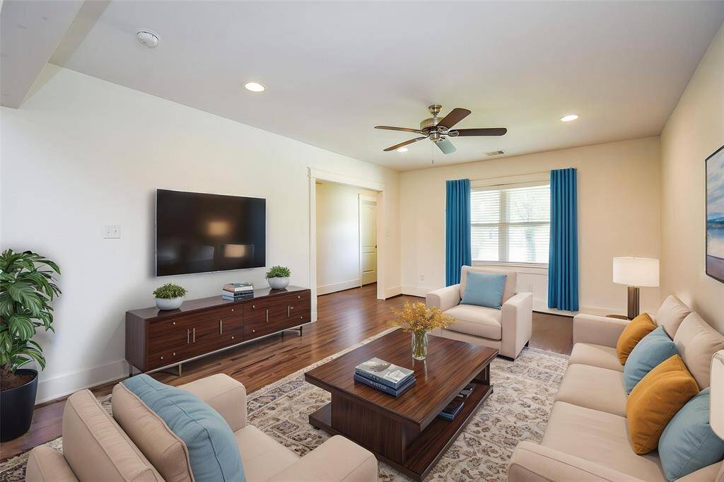 Large living room with plenty of natural light—virtually staged for design inspiration.