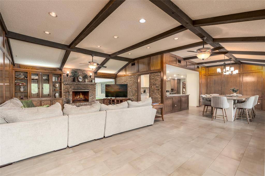 Large Living Room with tile flooring and recess Lighting .