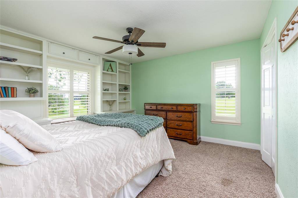 2nd Bedroom has Plantation Shutters and carpet on the flooring