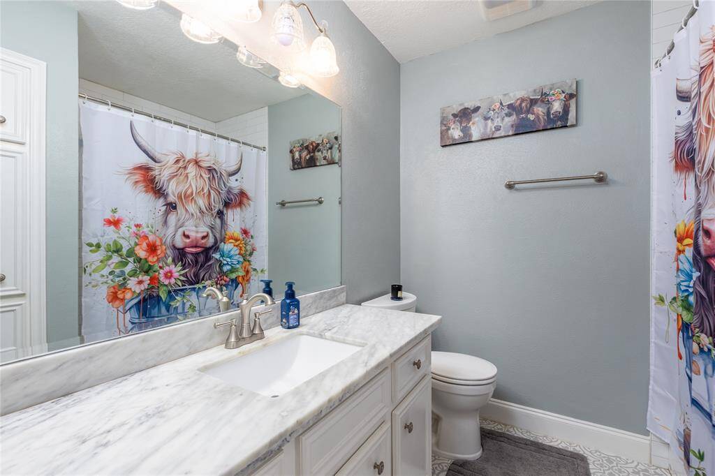 2nd Bathroom has tub with a shower.