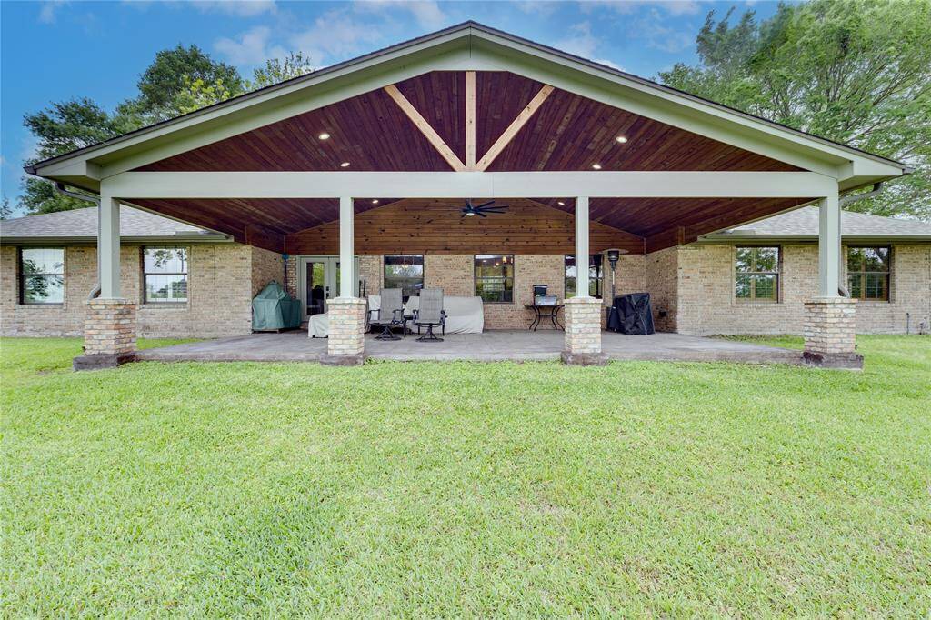 Lovely large side porch looks out onto the Lake.