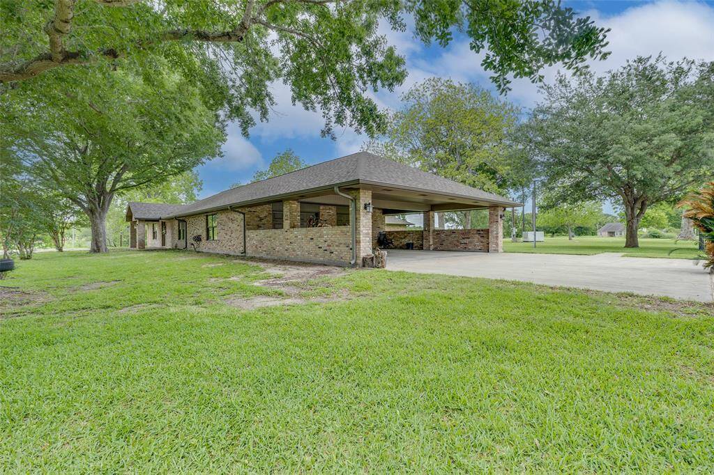 This lovely home has a large two car Porte-Cochere attached to the house.