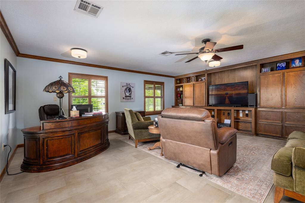 Family Room has a large built in TV center with extra storage.