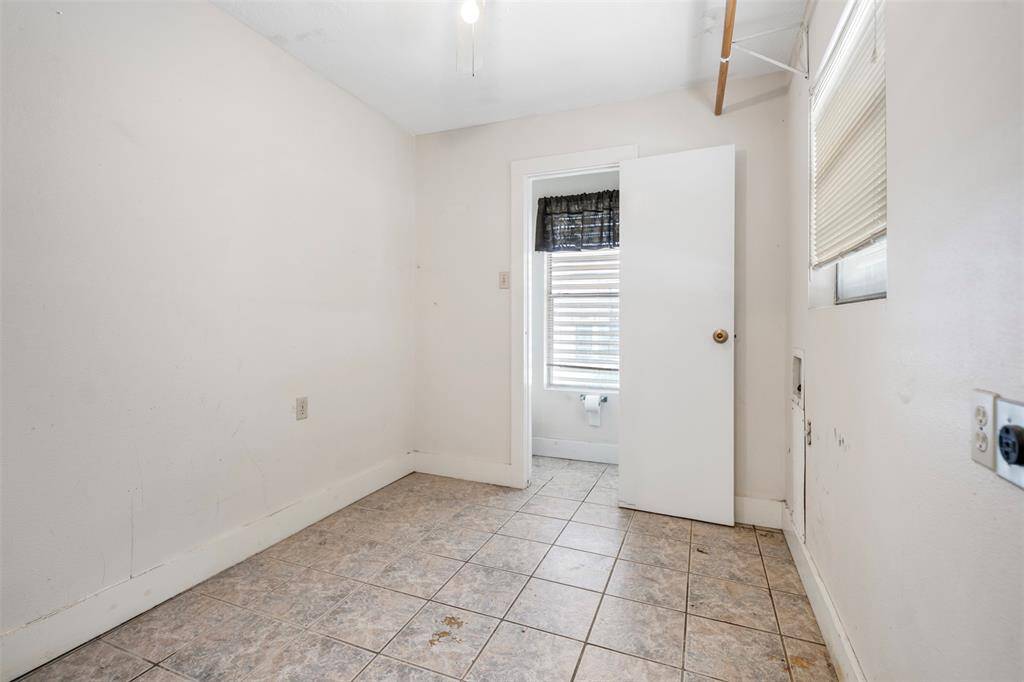 Laundry room with view of the half bathroom.