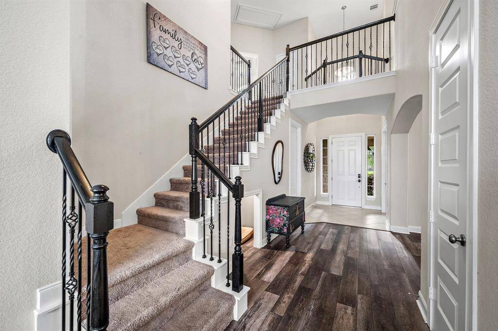 A grand staircase anchors the entryway, creating a beautiful first impression and offering a hint of the spacious, open layout that awaits beyond.